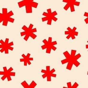 Red winter stars on a cream background