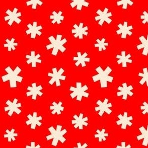 Cream winter stars on a red background