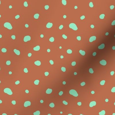Smooth little dotty - duotone spots and dots freehand messy confetti design neon mint on burnt orange sienna