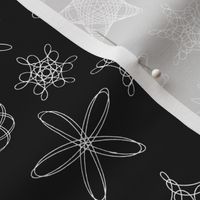 gear-drawn spiral designs - white on black  (life sized, 16" repeat)