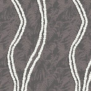 2 strand Pikake lei on mauve grey texture and fern