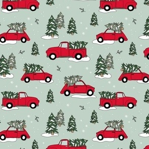 Christmas pick up - driving home for Christmas seasonal holidays snow pine trees and cars kids theme red green