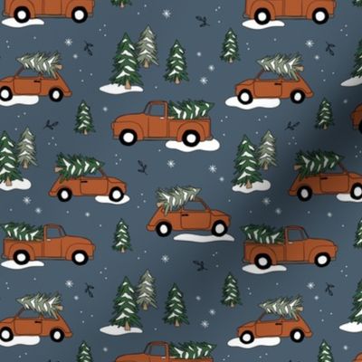Christmas pick up - driving home for Christmas seasonal holidays snow pine trees and cars kids theme rust on moody blue night