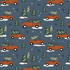 Christmas pick up - driving home for Christmas seasonal holidays snow pine trees and cars kids theme rust on moody blue night