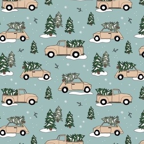 Christmas pick up - driving home for Christmas seasonal holidays snow pine trees and cars kids theme soft vanilla beige on blue