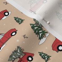 Christmas pick up - driving home for Christmas seasonal holidays snow pine trees and cars kids theme red green on soft peachy beige