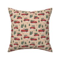 Christmas pick up - driving home for Christmas seasonal holidays snow pine trees and cars kids theme red green on soft peachy beige