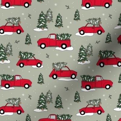 Christmas pick up - driving home for Christmas seasonal holidays snow pine trees and cars kids theme red green on light olive