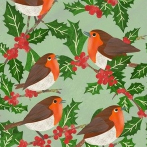 Paper cut Christmas robin red breasts on a holly bush with berries on green background