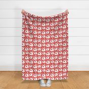 Blockprinted white vintage caravans with daisies and polka dots on brick red