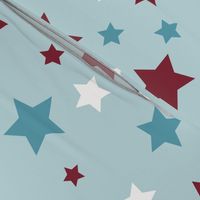 Red, white and blue stars on a pale blue background