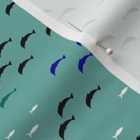 Dolphins and tiny fish, on green, tiny