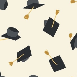 Medium Black and Gold Graduation Caps on Cream