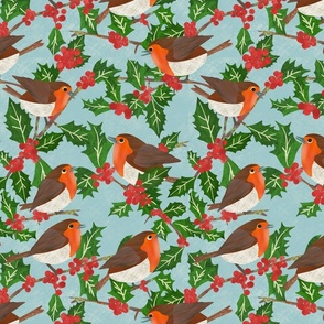 Paper cut Christmas robin red breasts on a holly bush with berries on pale blue background
