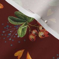 mountain ash and autumn leaves on a maroon background