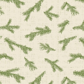 green pine tree branches on textured ivory