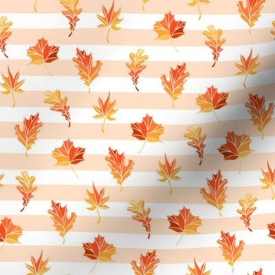 Fall leaves on the striped background