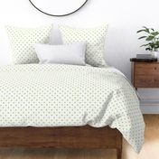 Small green polka dots on white background