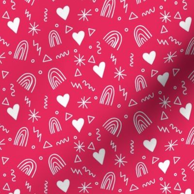 Calico pattern with hearts rainbows and stars white on pink