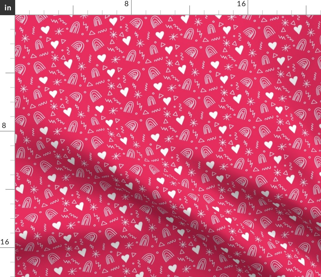 Calico pattern with hearts rainbows and stars white on pink