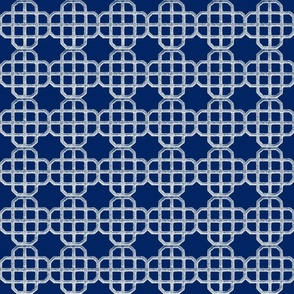 emboroidered looking knot in a navy blue background and white