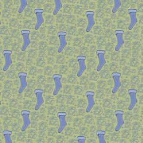 Blue stars, bells, and stockings with a green background.