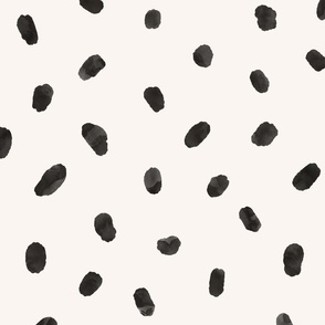 Black watercolor spots, brush strokes on beige background. Artistic abstract minimalistic pattern.