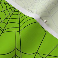 Spiderwebs on green