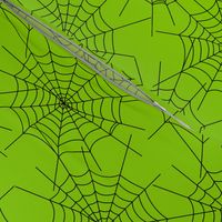 Spiderwebs on green