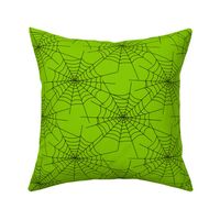 Spiderwebs on green
