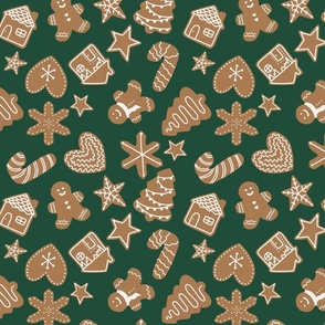 Gingerbread man christmas cookies tossed on green, ,medium scale