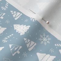 Boho christmas trees candy and snow flakes minimalist freehand vintage seventies trend white on moody blue