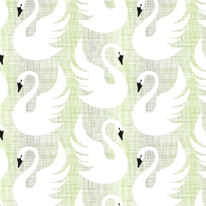 white swans on green-gray linen texture