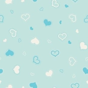 Shiny white and blue hearts on baby blue