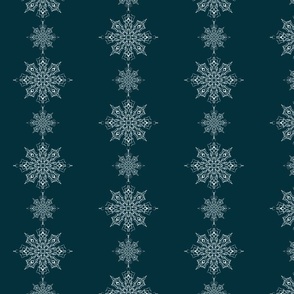 Delicate snowflakes arranged in lines on dark teal
