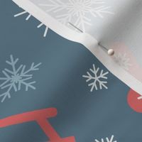 Red sleds and mittens on blue background with white snowflakes