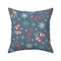 Red sleds and mittens on blue background with white snowflakes