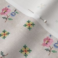 Antique Cross Stitch Floral Embroidery repeat pattern on linen texture