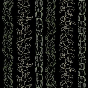 Flower lei strands on black