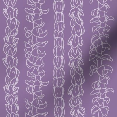 Flower lei strands on lavender 