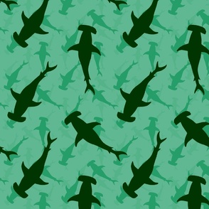 Dark Hammerhead Sharks Silhouette Circling  in Jade Green Water