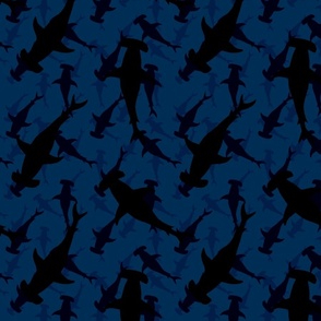 Dark Hammerhead Sharks Silhouette Circling  in Cobalt Blue Water
