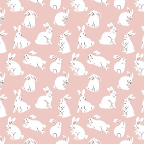 Cute white rabbits on pink background