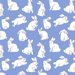 Cute white rabbits on blue background