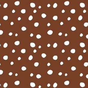 Small Scale White Dots on Cinnamon