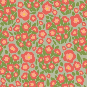 Simple red flowers on green background