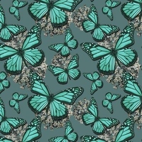 Vintage Monarch butterflies and flowers in blue-green