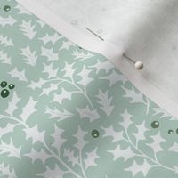 holly leaves and berries on light opal green | medium