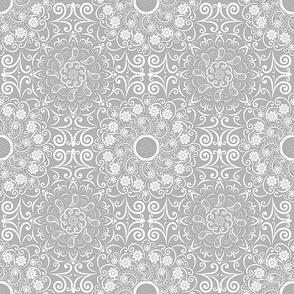White mandalas, boho style, grey background.
