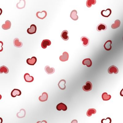 Scattered Red to pink ombre hearts on a white (unprinted) background